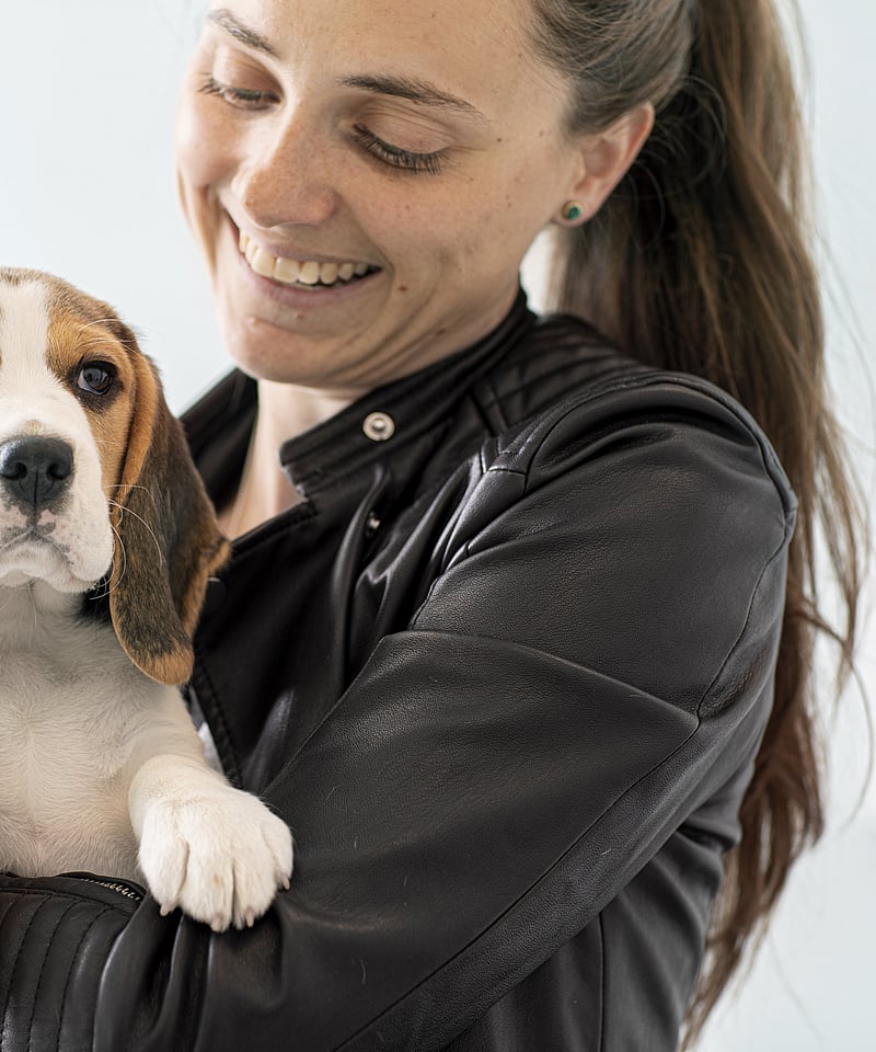 A person holding a dog.