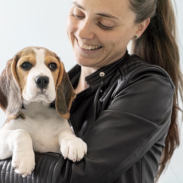 A person holding a dog.